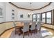 Formal dining room with large windows, elegant chandelier, and seating for eight at 3592 W Smokey Row Rd, Bargersville, IN 46106