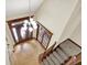 Open foyer with hardwood floors, elegant chandelier, and grand staircase at 3592 W Smokey Row Rd, Bargersville, IN 46106