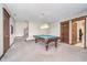 The game room features a classic pool table, perfect for entertaining guests, and a staircase at 3592 W Smokey Row Rd, Bargersville, IN 46106