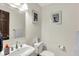 Bright half bathroom featuring pedestal sink and decorative towels at 3592 W Smokey Row Rd, Bargersville, IN 46106