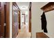 Hallway features hardwood floors, wood trim, hall tree, and multiple access points to other rooms at 3592 W Smokey Row Rd, Bargersville, IN 46106