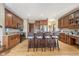 Beautiful kitchen with wood cabinets, stainless appliances, granite counters and seating at the island at 3592 W Smokey Row Rd, Bargersville, IN 46106