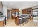 Spacious kitchen with a large island, wood cabinetry, stainless steel appliances, and hardwood floors at 3592 W Smokey Row Rd, Bargersville, IN 46106