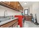 Laundry room with modern washer and dryer, granite counters, and lots of storage at 3592 W Smokey Row Rd, Bargersville, IN 46106