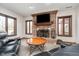 Inviting living room featuring a brick fireplace with decorative mantel and ample natural light at 3592 W Smokey Row Rd, Bargersville, IN 46106