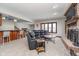 Cozy living room featuring a fireplace with brick surround, wet bar and comfortable seating area at 3592 W Smokey Row Rd, Bargersville, IN 46106