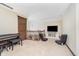 Spacious loft area with neutral carpet, a TV, and additional seating for watching television at 3592 W Smokey Row Rd, Bargersville, IN 46106
