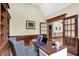 Cozy office with wood paneling, built-in bookshelves, and natural light at 3592 W Smokey Row Rd, Bargersville, IN 46106