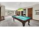 Bright recreation room with a pool table, fireplace, and access to the backyard at 3592 W Smokey Row Rd, Bargersville, IN 46106