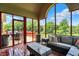 Screened porch has ample seating and a view of the surrounding yard, perfect for relaxing and entertaining at 3592 W Smokey Row Rd, Bargersville, IN 46106