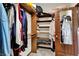 Organized walk-in closet with built-in shelving, ample storage, and a mirrored door at 3592 W Smokey Row Rd, Bargersville, IN 46106