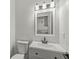 Updated bathroom with modern lighting, vanity, faucet, and fixtures at 5845 Shipwatch Pl, Indianapolis, IN 46237