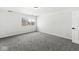 Bedroom with gray carpet, neutral paint, and a window providing natural light at 5845 Shipwatch Pl, Indianapolis, IN 46237