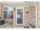 A close up view of the brick facade, front door, and house number at 5845 Shipwatch Pl, Indianapolis, IN 46237