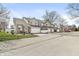 View of townhouses with attached garages and well-manicured lawns at 5845 Shipwatch Pl, Indianapolis, IN 46237