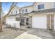 Townhouse with attached garage, fenced yard, vinyl siding, and well-kept landscape at 5845 Shipwatch Pl, Indianapolis, IN 46237