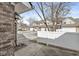 Townhouse exteriors with attached garages and adjacent vinyl fencing at 5845 Shipwatch Pl, Indianapolis, IN 46237