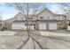 Townhouse complex with attached garages, vinyl siding, and well-kept lawns at 5845 Shipwatch Pl, Indianapolis, IN 46237