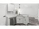 Kitchen sink with stainless steel appliances, white cabinets, and subway tile backsplash at 5845 Shipwatch Pl, Indianapolis, IN 46237