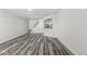 A modern living space showcasing new floors, a ceiling fan, and an open layout at 5845 Shipwatch Pl, Indianapolis, IN 46237