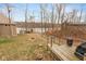 Scenic backyard overlooking the lake with a fire pit, shed, and wooden deck area at 7987 N Lasalle Rd, Morgantown, IN 46160