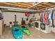 Unfinished basement with exposed pipes, laundry appliances, and kayaks, offering potential for customization at 7987 N Lasalle Rd, Morgantown, IN 46160