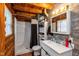 Rustic bathroom with a modern vanity, walk-in shower, and wooden accents, providing a blend of comfort at 7987 N Lasalle Rd, Morgantown, IN 46160