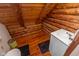 Compact bathroom with wood walls, a corner sink, and essential amenities, maximizing space efficiently at 7987 N Lasalle Rd, Morgantown, IN 46160