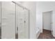 Bright bathroom featuring a glass-enclosed shower and separate bathtub at 113 Luna Pl, Shelbyville, IN 46176