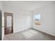 Bedroom with carpet and neutral walls featuring an entrance and a closet at 113 Luna Pl, Shelbyville, IN 46176