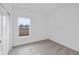 A bedroom features neutral carpeting, a bright window, and a closet at 113 Luna Pl, Shelbyville, IN 46176