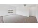 A spacious bedroom features neutral carpeting, a bright window, and light paint at 113 Luna Pl, Shelbyville, IN 46176