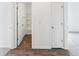 Open hallway showcases a full bathroom and entrance to a carpeted bedroom at 113 Luna Pl, Shelbyville, IN 46176