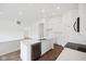 Bright kitchen featuring white cabinets, stainless steel appliances, and a center island with a sink at 113 Luna Pl, Shelbyville, IN 46176