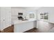 Bright kitchen with white cabinets, stainless steel appliances, a center island, and sliding glass doors at 113 Luna Pl, Shelbyville, IN 46176