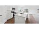 Modern kitchen featuring white cabinets, stainless steel appliances, a center island and hardwood floors at 113 Luna Pl, Shelbyville, IN 46176