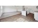 Open-concept kitchen and living room featuring hardwood floors, carpet, and modern appliances at 113 Luna Pl, Shelbyville, IN 46176