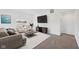 Inviting living room featuring neutral-toned furniture, bright light, and plush carpeting at 113 Luna Pl, Shelbyville, IN 46176