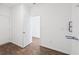 Utility room with water lines, wood-look flooring and doorways to other rooms at 113 Luna Pl, Shelbyville, IN 46176