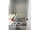 Modern bathroom featuring a tub/shower combination and light gray wood-look flooring at 1433 Wigwam Ln, Martinsville, IN 46151
