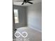 Bright bedroom with a ceiling fan, window, and neutral walls at 1433 Wigwam Ln, Martinsville, IN 46151