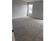 A bedroom featuring plush gray carpeting and neutral walls at 1433 Wigwam Ln, Martinsville, IN 46151