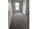 A well-lit bedroom with gray carpet and a bright window at 1433 Wigwam Ln, Martinsville, IN 46151
