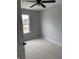 Comfortable bedroom with neutral walls, ceiling fan, and plenty of natural light at 1433 Wigwam Ln, Martinsville, IN 46151