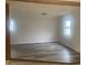 Dining area featuring wood flooring and a view into the kitchen at 1509 Edgewood Dr, Crawfordsville, IN 47933