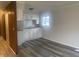 Updated kitchen with white cabinets and subway tile backsplash at 1509 Edgewood Dr, Crawfordsville, IN 47933
