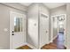 Bright entryway showcases an exterior door, interior doors, and neutral decor at 1622 Prospect St, Indianapolis, IN 46203