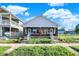 Charming bungalow-style home featuring dual entrances, a covered porch, and a manicured lawn at 1622 Prospect St, Indianapolis, IN 46203