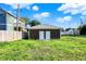 Backyard view of a detached garage with double doors providing convenient storage at 1622 Prospect St, Indianapolis, IN 46203