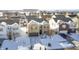 Aerial view of a two-story brick home in a snow-covered neighborhood at 2959 Hearthside Dr, Greenwood, IN 46143